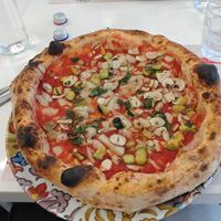 Vegan pizza with vegan mozzarella, mushrooms and zucchini.  at Rossopomodoro in Rimini