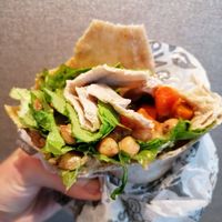 Hummus wrap with tomatoes and lettuce at Isla Vegana in Ushuaia