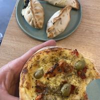 Vegan pizza bread, spinach empanadas and cheese empanadass  at Isla Vegana in Ushuaia