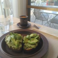 Cortado and sourdough bread with avocado at Kumi Oslobukta in Oslo