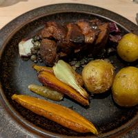 Lion's mane mushroom with a red wine reduction, root vegetables and potatoes at Kumi Oslobukta in Oslo
