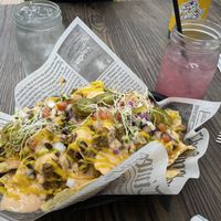 Nachos and hibiscus lemonade  at Cocina Plantosaurus in Charles Town