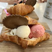 Pineapple and strawberry ice cream in a croissant   at Fabrika in Tirana