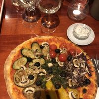 Vegan pizza with vegetables and extra olives and garlic sauce  at Pizzeria Central in Vilpiano