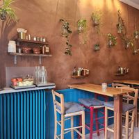 Side salad and water station at Reggev Hummus Södermalm in Stockholm