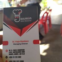 Owners card, speaks English well at Jasmine in Pakse