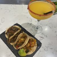 Tacos de calabacín ranchero y tacos de nopales + mango margarita   at Tiki Taco - Clavel in Madrid