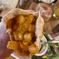 Delicious channa masala stuffed wrap at East is East - Silk & Spice in Vancouver