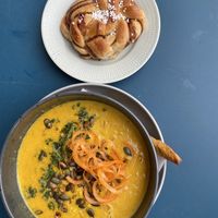 Soup of the week (corn soup) + vegan cardamom bun  at Blå+ in Stockholm