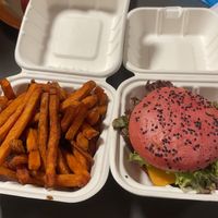 Beyond Meat Burger with vegan cheese and vegan sauce with sweet potato fries. at No Name in Disentis Muster