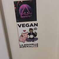 Two of the many stickers inside the bathroom at B.Better in Paris
