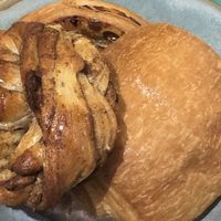 From left to right, cinnamon roll, pain aux raisins, and pain au chocolat  at Land & Monkeys - Turenne in Paris