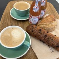 Breakfast menu with Cappuccino, juices, viennoiserie au chocolat and Chausson à la pomme  at Land & Monkeys - Turenne in Paris
