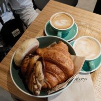 Cappuccinos, croissants, and pastry  at Land & Monkeys - Turenne in Paris