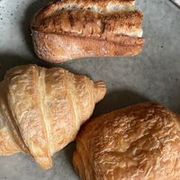 Piece of baguette, croissant and pain au chocolat (taken home)  at Land & Monkeys - Turenne in Paris