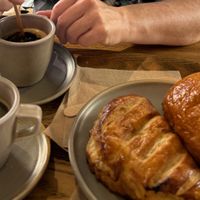 Fresh vegan pastries (chausson aux pommes and pain au chocolat). at Land & Monkeys - Turenne in Paris