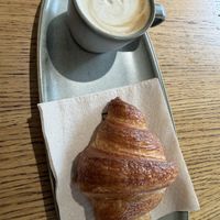 Oat cappuccino and croissantt  at Land & Monkeys - Turenne in Paris