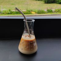 Cappuccino with the castle in the background at Arbuste in Caen