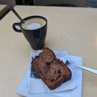 Oat latte with delicious vegan banana bread! at Shake Café in Florence