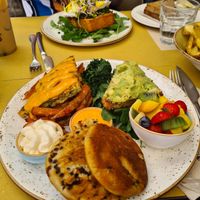 Mega Vegan Brunch Plate, avo toast, orange and choc pancakes, vegan cream, chickpea omelette, fresh fruit, sweet potato fries, spinach at Shake Café in Florence