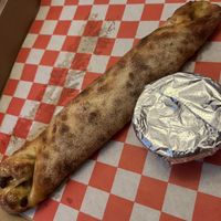 Snausage roll with onions  at Attilio's Pizzeria in Toms River
