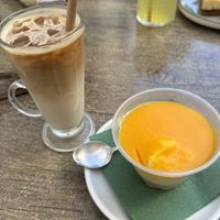 Iced latte with oat milk and a mango dessertt  at Café Lex in Szentendre
