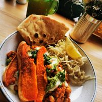 Roasted butternut squash on Lentils and chickpeas in a spicy apricot tomato and ginger sauce. at Döner Bei Tante Anne in Norwich