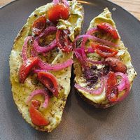 Avocado bread with pickled onions and tomatoes at FINT Kafé & Bar in Tromsoe