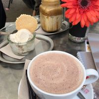 Hot chocolate and salted caramel Dalgona coffee with a bowl of something. at Delikat  in Viersen