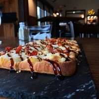 Flat bread of the day made vegan (Balsamic vinaigrette, sun dried tomatoes, and daiya cheese) my fav appetizer now!   at Alcona Brew Haus in Harrisville