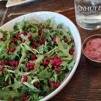 Pomegranate salad modified for vegan - yummy dressing at Oyhut Bay Grill in Ocean Shores