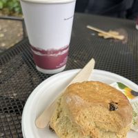 Scone, oat milk latte  at Clock Tower Cafe in Morpeth