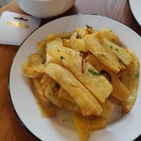 Fried potatoes and onions. at Honoré in Tbilisi