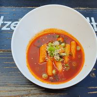 Tteokbokki: spicy ricecake sticks, can be used as starter at Omma's Kitchen in Enschede