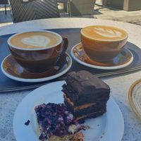 Blueberry and chocolate manderine cake with a plant based milk-coffee at Fika Cafe in Jakobstad
