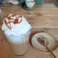 Maple spice latte made with oatmilk & extra topping vegan whip cream  at Coffee Break in Groningen