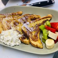 Vegan French Toast with seasonal fruit and vegan cream  at The Sage Village in Campbelltown