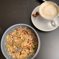 Chia pudding with fruit and peanut butter and a cappuccino.  at B-liv Cagliari in Cagliari