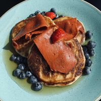 Pancakes with blueberries and vegan bacon  at Holy Cow Lounge in Edinburgh