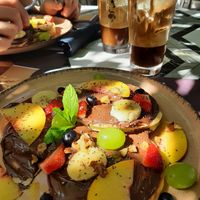 Chocolate pancakes with seasonal fruits & almond milk frappes at Libre Garden in Pefkochori