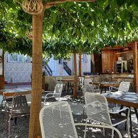 Lovely outdoor seating area  at Libre Garden in Pefkochori