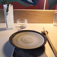 Place setting at the bar and Shrinrinyoku cocktail at KUSAKI in Brighton