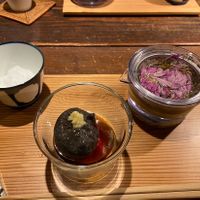 Our dessert! This beautiful herbal floral iced tea and black sesame pudding?  at AWOMB Nishikiyamachi in Kyoto