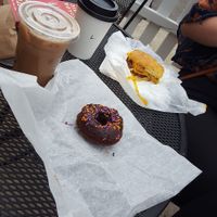 Mocha, latte, donut, and breakfast sandwich at Mud Pie Vegan Bakery and Coffee in Kansas City