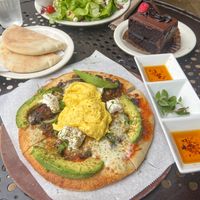 Huevos rancheros pizza can be made vegan upon request with vegan eggs, soyrizo, and almond cheese. Vegan chocolate cake!  at Urth Caffé in Pasadena