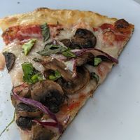 Slice of vegan pizza. at Cucina Ristorante Pizza Bar in Dania Beach