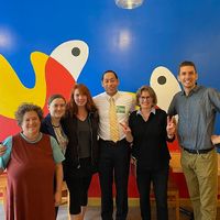 Group photo in their party room at Pizzeria Paradiso in Washington