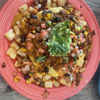 Fiesta Hash with vegan chorizo, vegan queso, just egg over potatoes   at The Breakfast Club in Des Moines