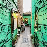 Entrance from street and outdoor garden seating   at Mali Vegan Thai in South West London