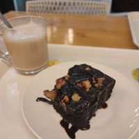 Warm vegan brownie and coconut milk tea at Always Happy Food co. in Kathmandu
